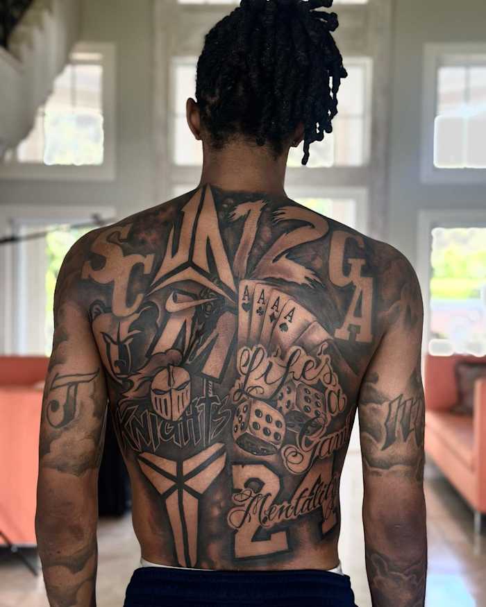 View of Ja Morant's back tattoos.